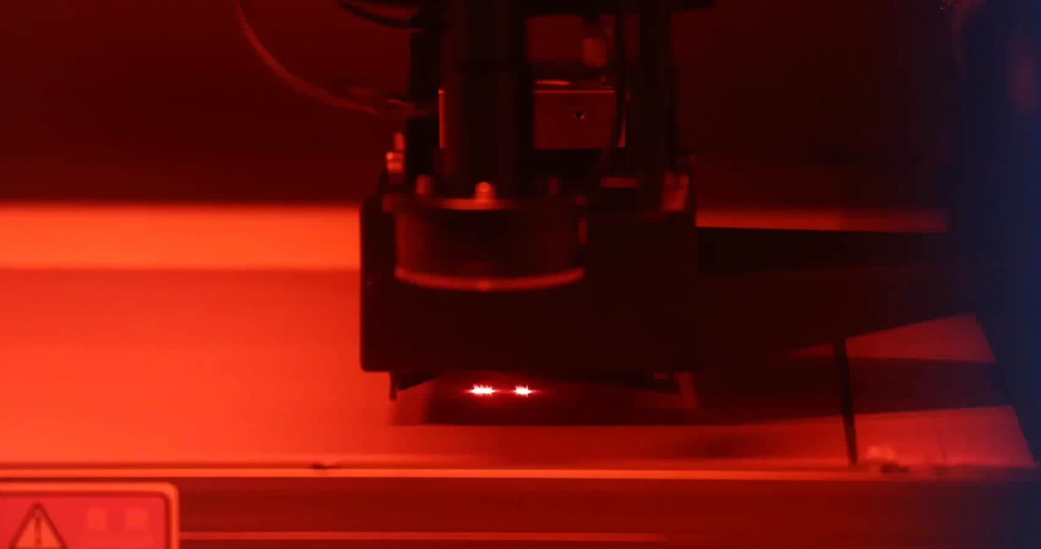 Laser drilling machine machining microvias on a multilayer PCB panel inside the production line