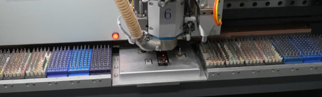 CNC mechanical drilling machine with automatic tool change processing a multilayer PCB panel