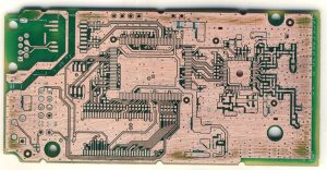 Bare copper circuitry exposed on a PCB after the soldermask was removed, the starting point of controlled layer-by-layer analysis