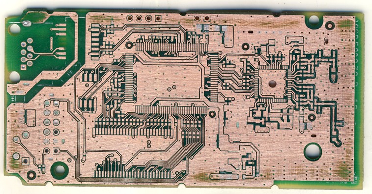 Bare copper circuitry exposed on a PCB after the soldermask was removed, the starting point of controlled layer-by-layer analysis