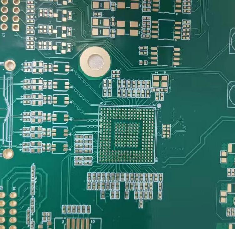 Close-up of a finished PCB showing plugged vias across a dense BGA field